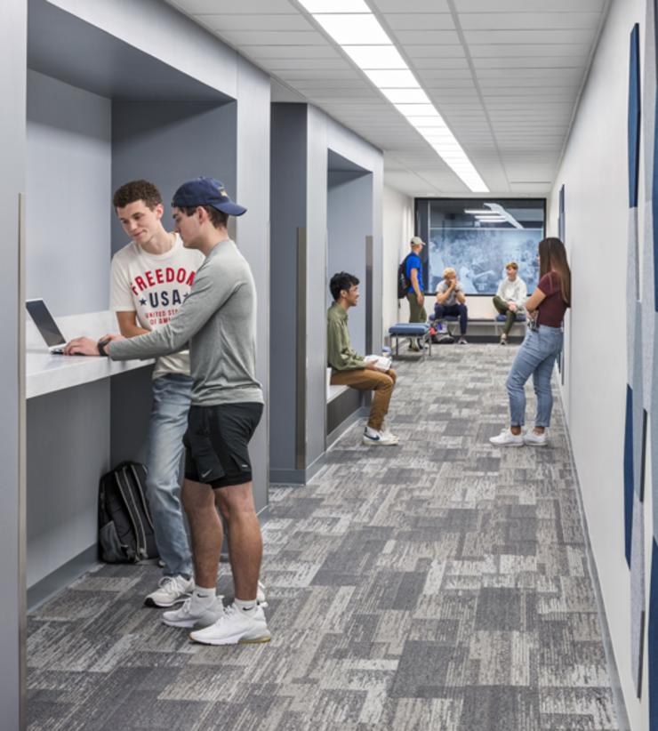 Students hang out in a hallway together