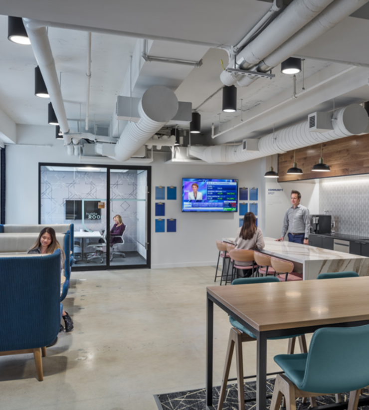Kitchen area in their new office with a community corner