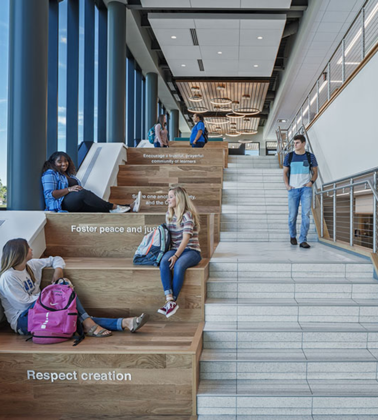 Students gather on the large feature stair