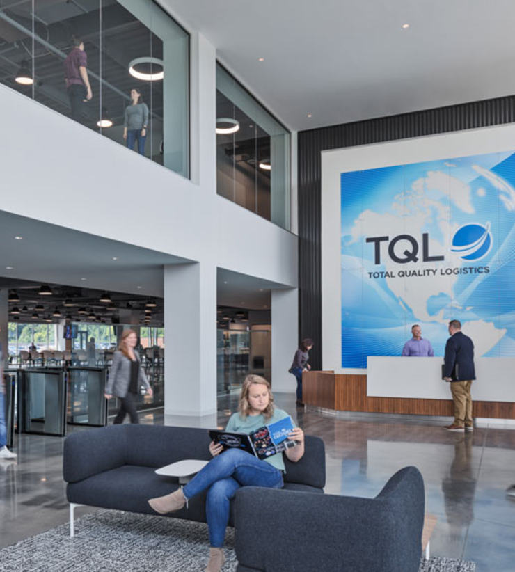 A bright and airy lobby with a large TQL sign above the receptionist desk
