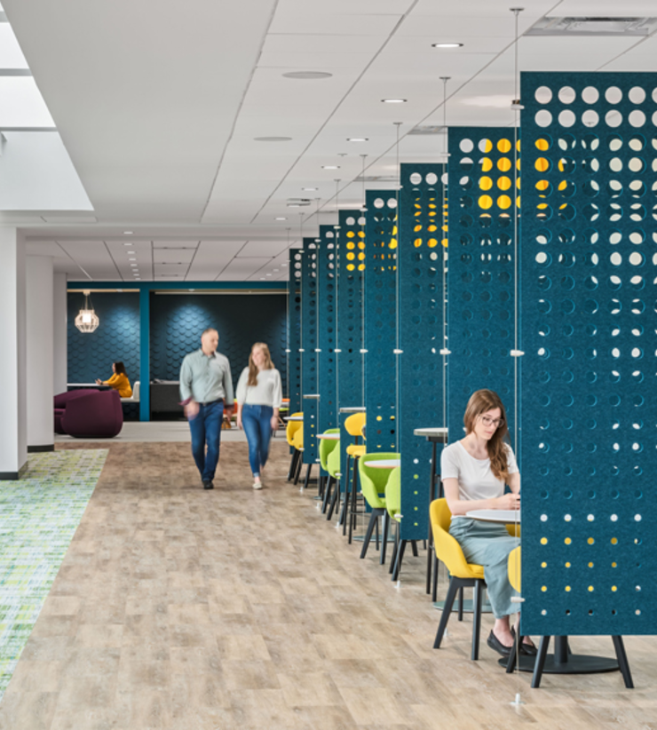 Employees walk through the lower level amenity space
