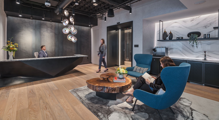 Man walking into a lobby of an office
