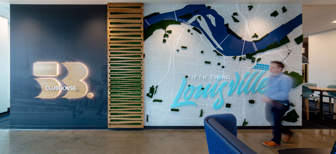 One of the experiential graphic design elements in the space features a map of downtown Louisville.