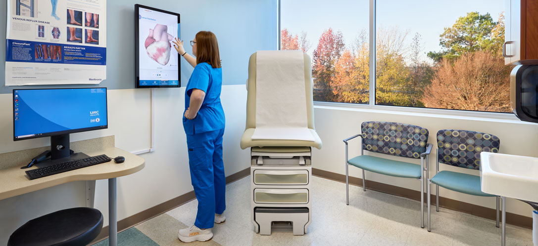 Women nurse working at touch screen
