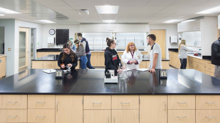Students working together with their teacher in a laboratory/classroom