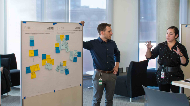 Three people in discussion