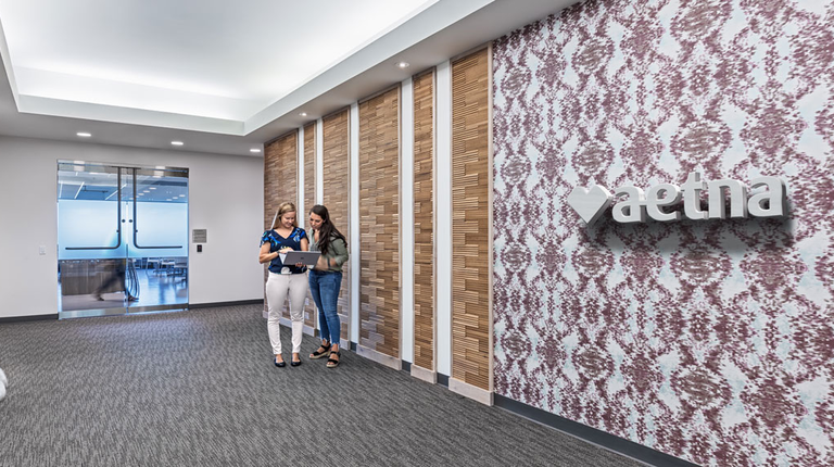Interior view of branded accent wall within Aetna's newly renovated St. Louis office