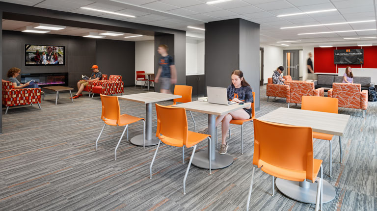 Students working and socializing in commons area of Miller Hall at Heidelberg University.