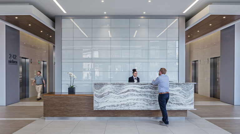 People standing in lobby of Columbia Plaza