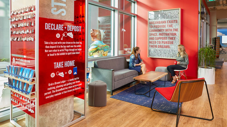 Two people meeting in the DreamBank at American Family Insurance 