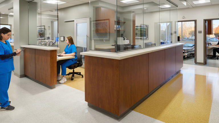 A central nurses’ station serves as the hub of the space