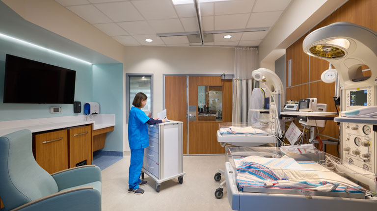 Woman working in the newly renovated NICU at UNC Health Rex Holly Springs