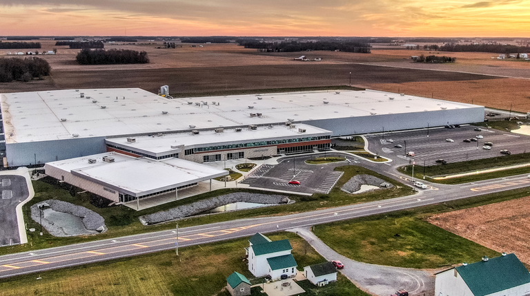 The Airstream facility is shown from a drone during sunset